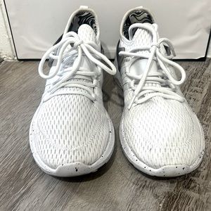 Fabletic athletic white with Smokey black back trim and black specks of paint.